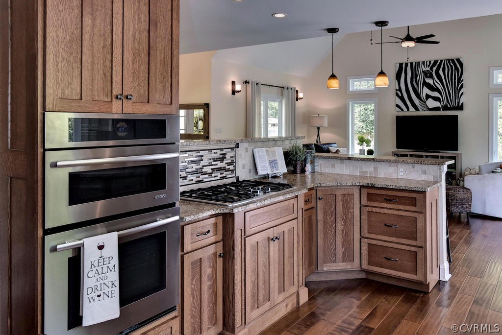 258 Sandy Bay Road Williamsburg, VA 23185 - Photo 14 of 50 a kitchen with stainless steel appliances a stove a sink and a microwave