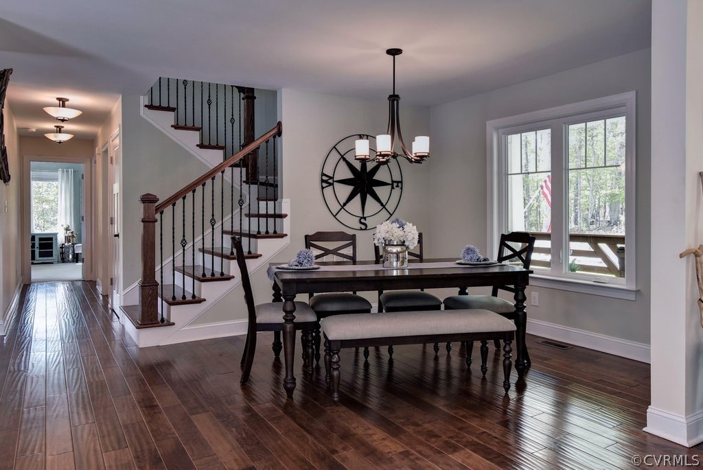 258 Sandy Bay Road Williamsburg, VA 23185 - Photo 15 of 50 a view of a dining room with furniture window and wooden floor