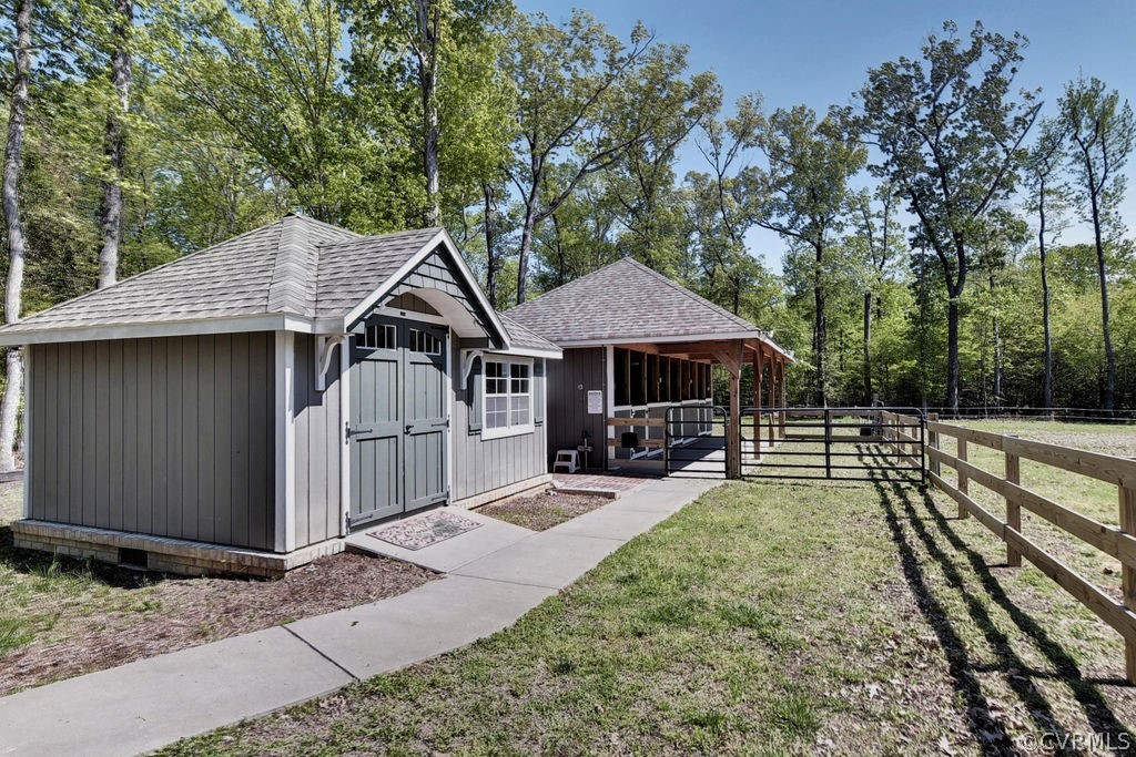 258 Sandy Bay Road Williamsburg, VA 23185 - Photo 35 of 50 a house view with a sitting space and garden