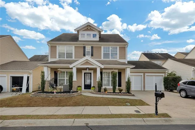 a front view of a house with a yard