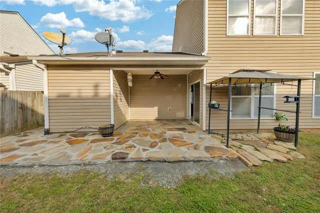 a view of a lounge chair in the backyard