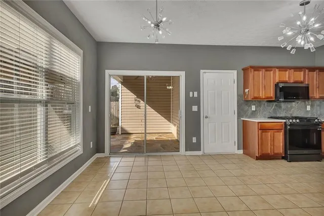 a view of a kitchen with a sink and a window