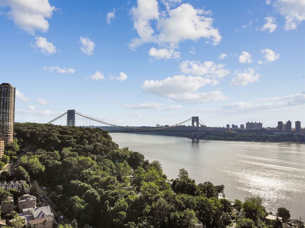 1464 River Road, Unit 4 Edgewater, NJ 07020 - Photo 1 of 1 a view of a lake with a building in the background