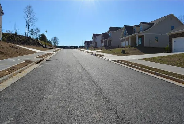 a view of street with large building