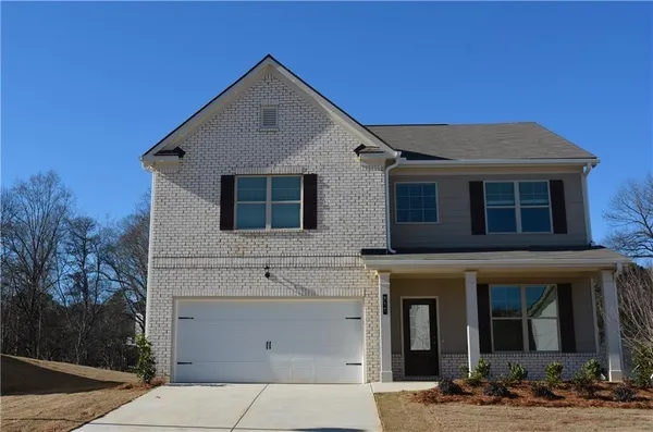 a front view of a house with garage