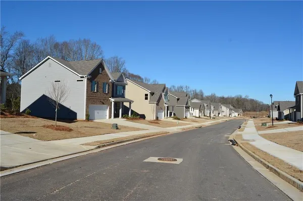 a view of a street with a house