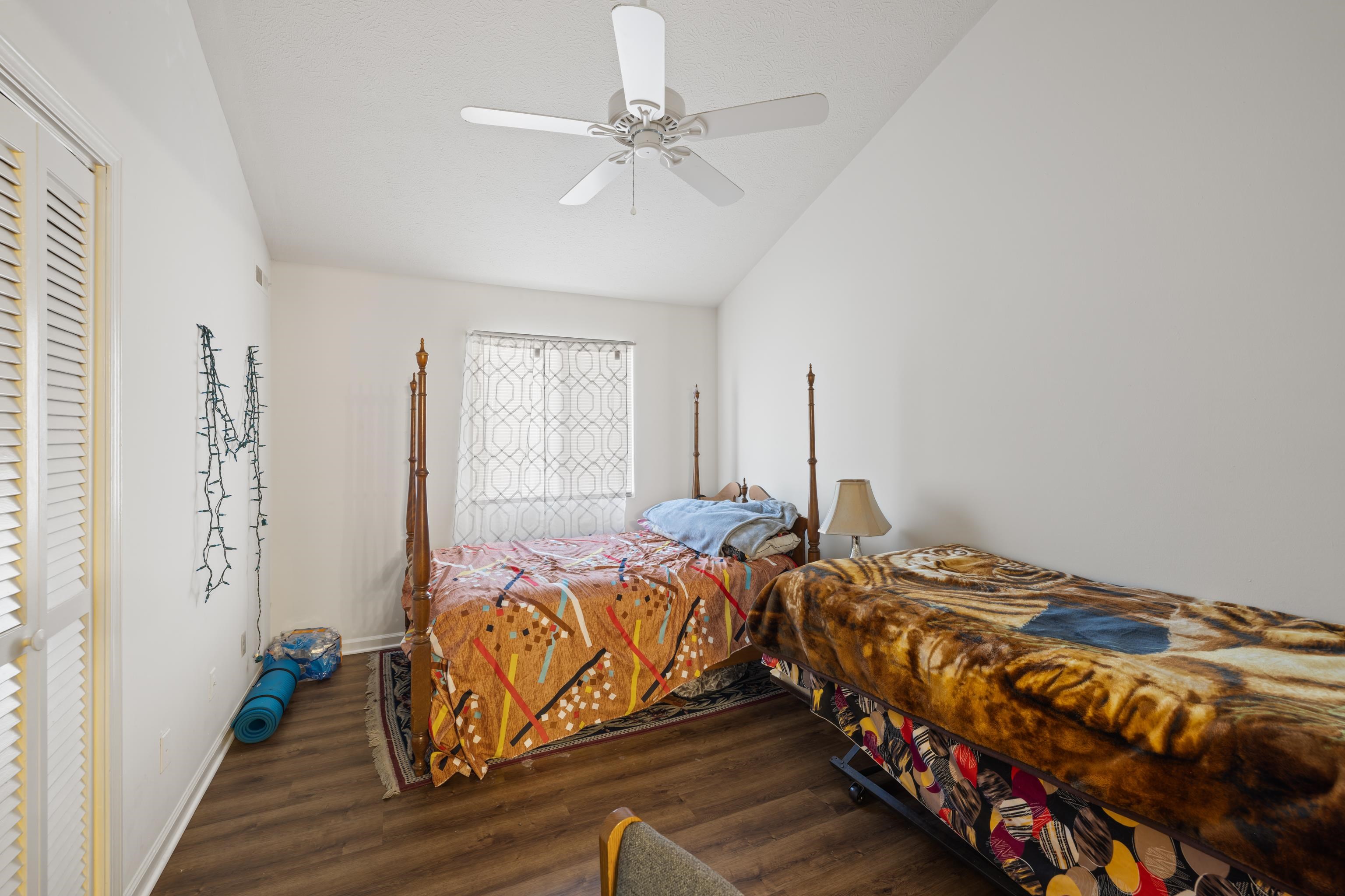 1116 Blue Ridge Drive, Unit 11 Harrisonburg, VA 22802 - Photo 15 of 21 a bedroom with two beds and a chandelier