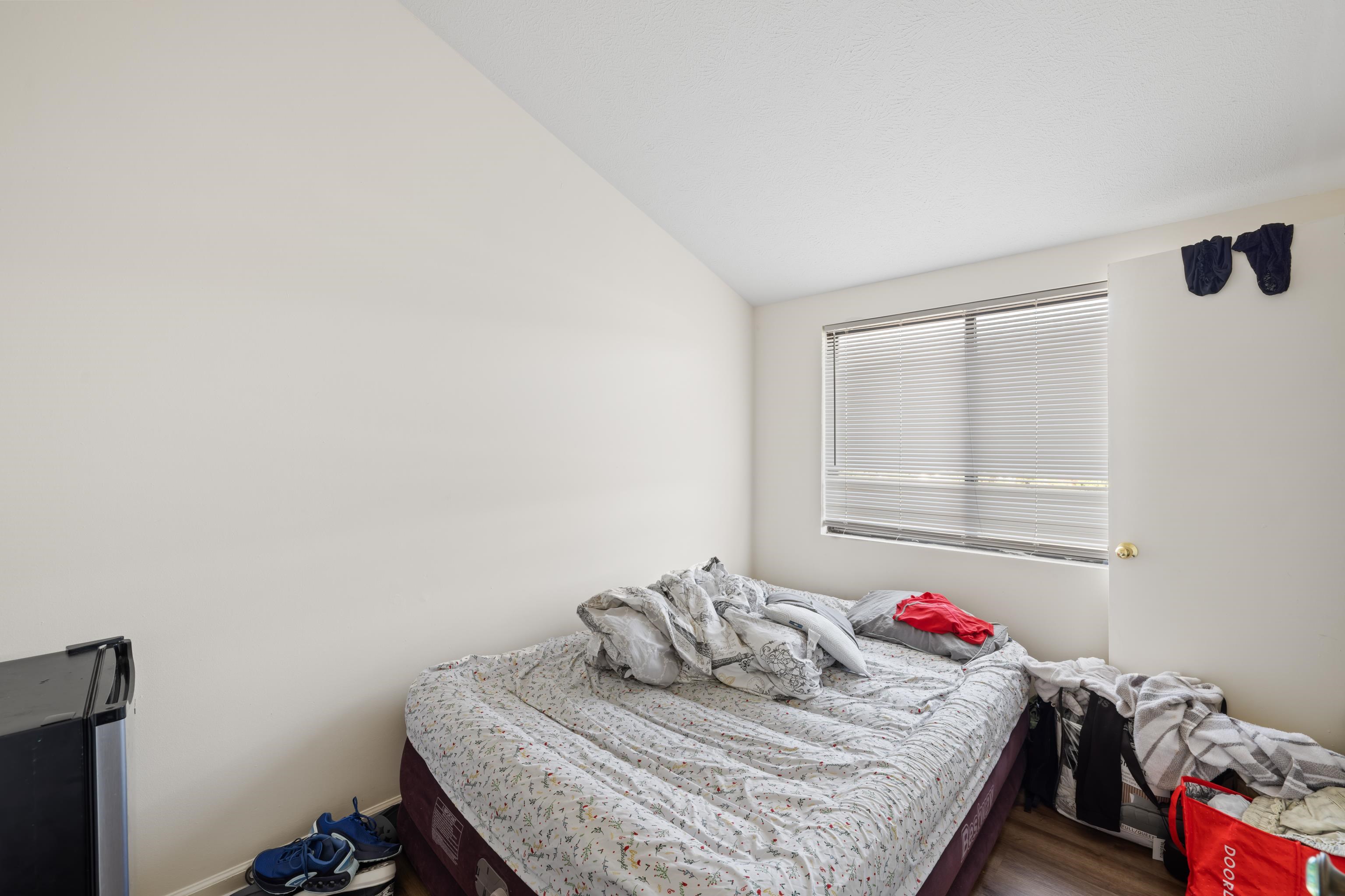 1116 Blue Ridge Drive, Unit 11 Harrisonburg, VA 22802 - Photo 17 of 21 a bedroom with a bed and dresser