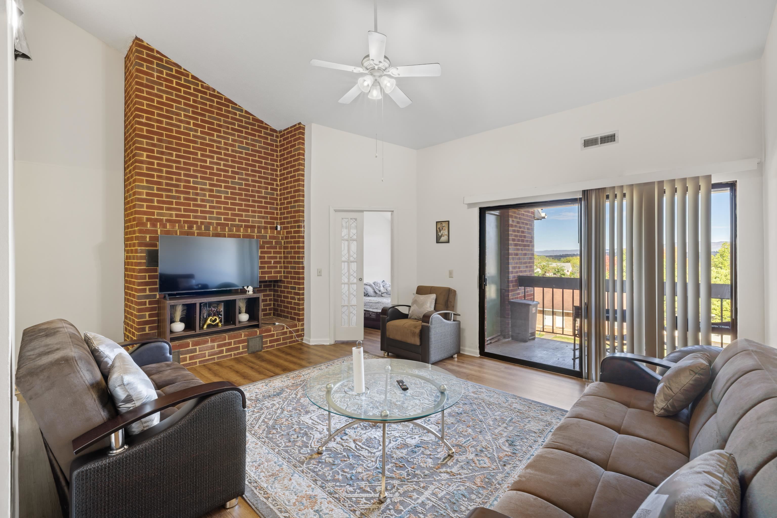 1116 Blue Ridge Drive, Unit 11 Harrisonburg, VA 22802 - Photo 8 of 21 a living room with furniture a large window and a flat screen tv