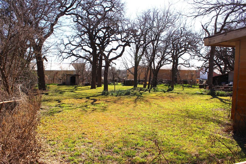 403 Mockingbird Street Chico, TX 76431 - Photo 18 of 25 a view of swimming pool with trees