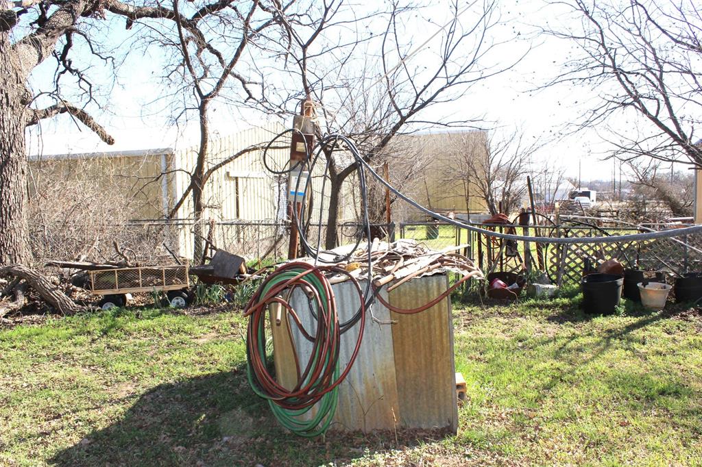 403 Mockingbird Street Chico, TX 76431 - Photo 24 of 25 a backyard of a house with lots of green space
