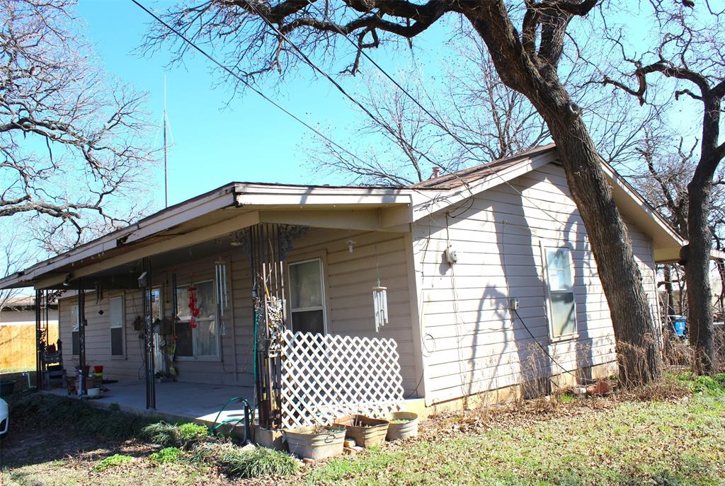 403 Mockingbird Street Chico, TX 76431 - Photo 25 of 25 a side view of a house