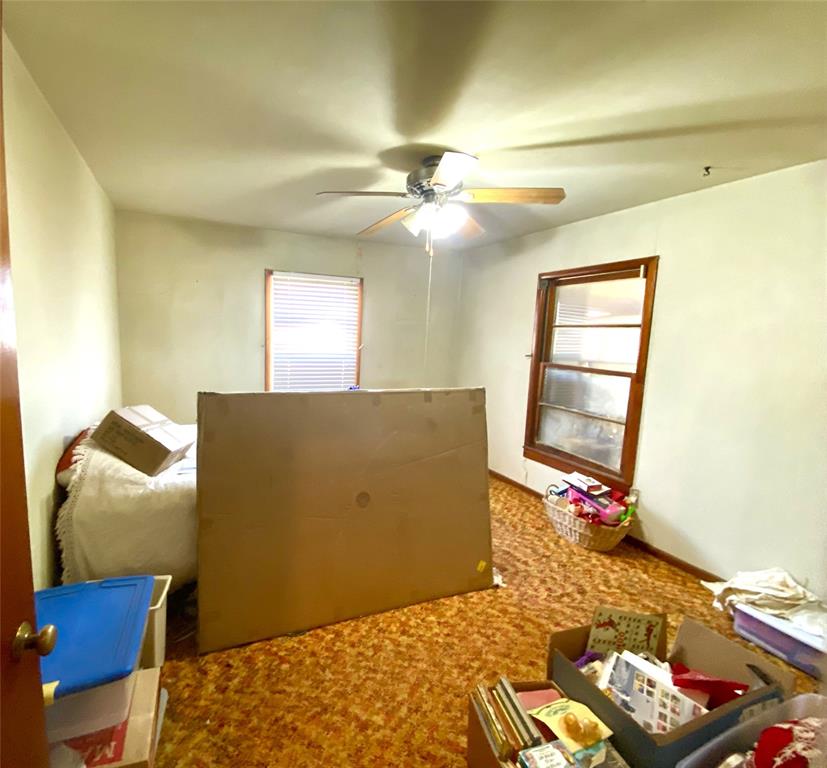 403 Mockingbird Street Chico, TX 76431 - Photo 9 of 25 a bedroom with a bed and furniture