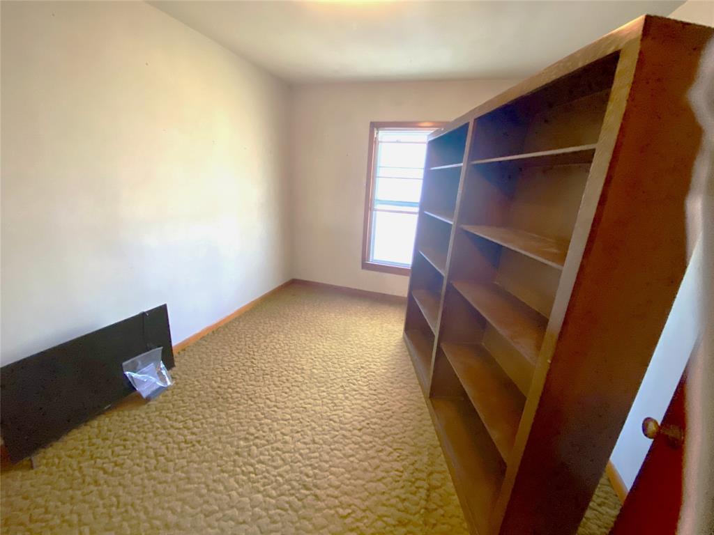 403 Mockingbird Street Chico, TX 76431 - Photo 10 of 25 a view of room with wooden floor