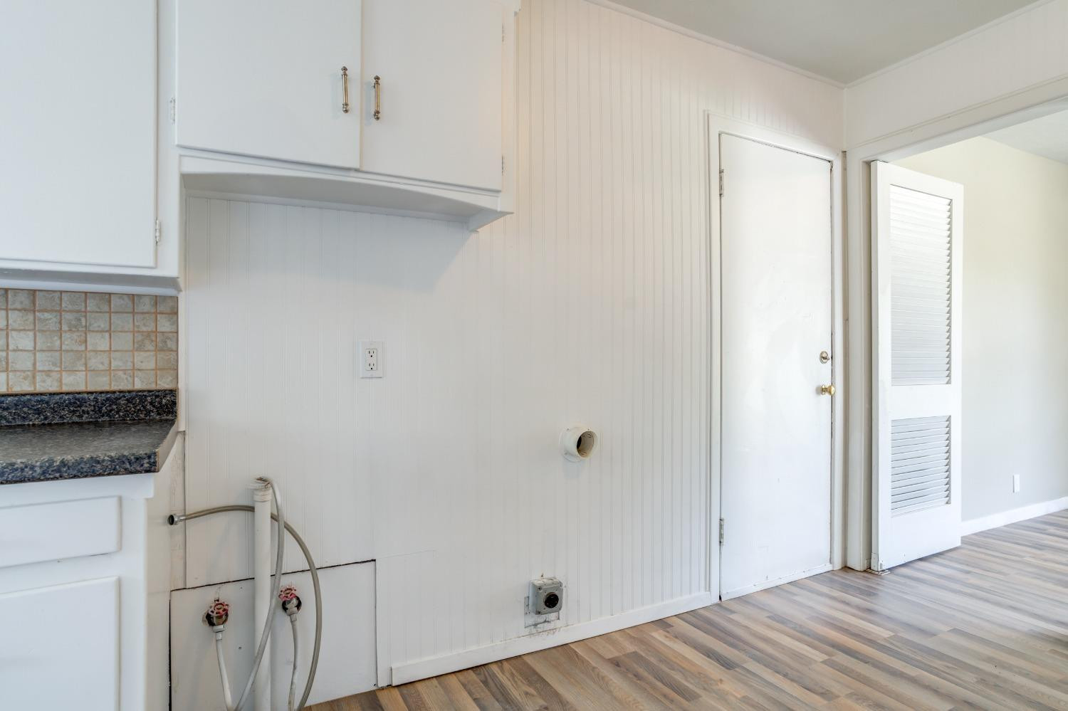 3411 41st Street Lubbock, TX 79413 - Photo 12 of 29 a view of a hallway with wooden floor and closet