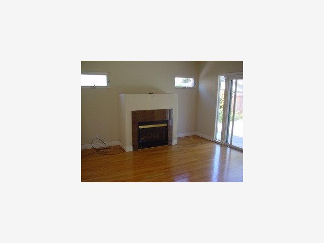 200 Rhodes Court San Jose, CA 95126 - Photo 5 of 9 a picture of a living room with a fireplace