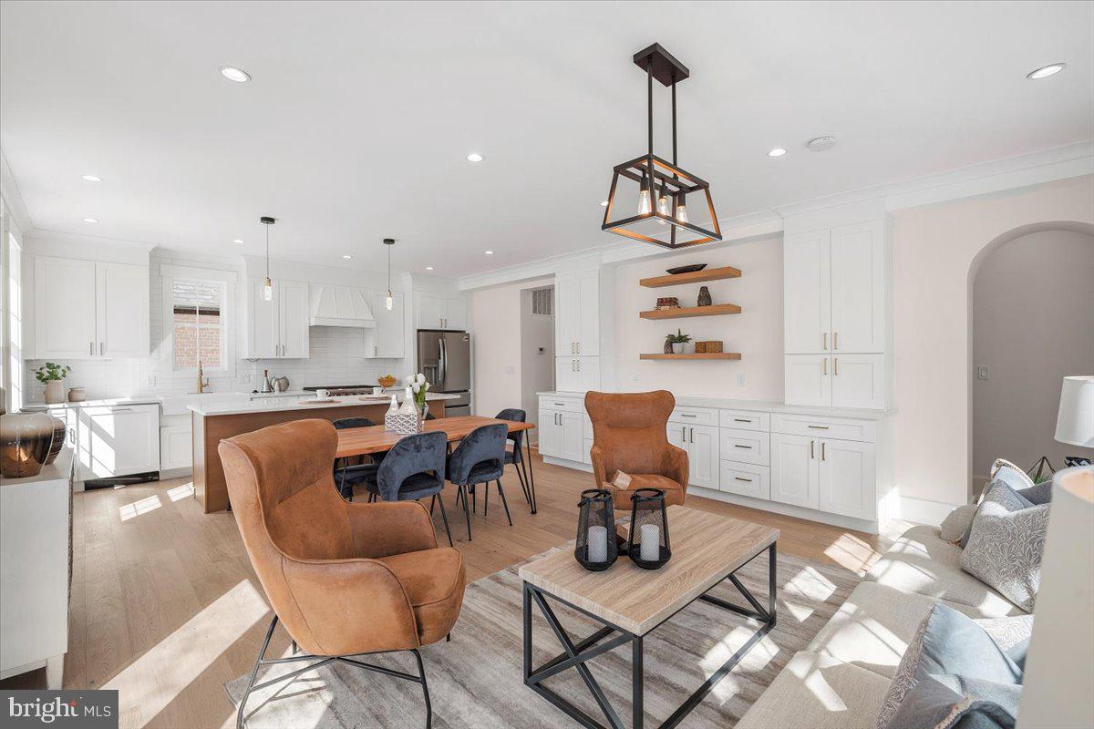 800 Elder Street Northwest Washington, DC 20012 - Photo 22 of 56 a living room with furniture kitchen view and a chandelier