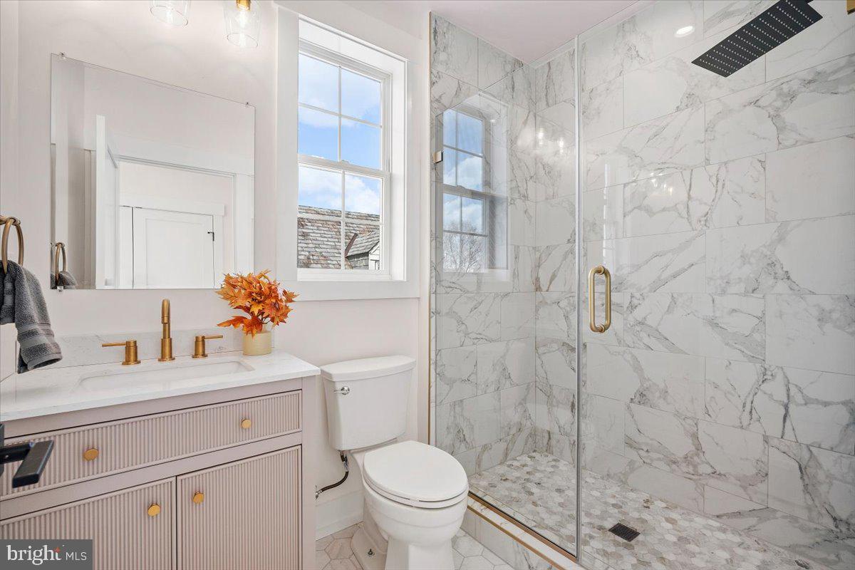800 Elder Street Northwest Washington, DC 20012 - Photo 28 of 56 a bathroom with a sink toilet vanity and shower