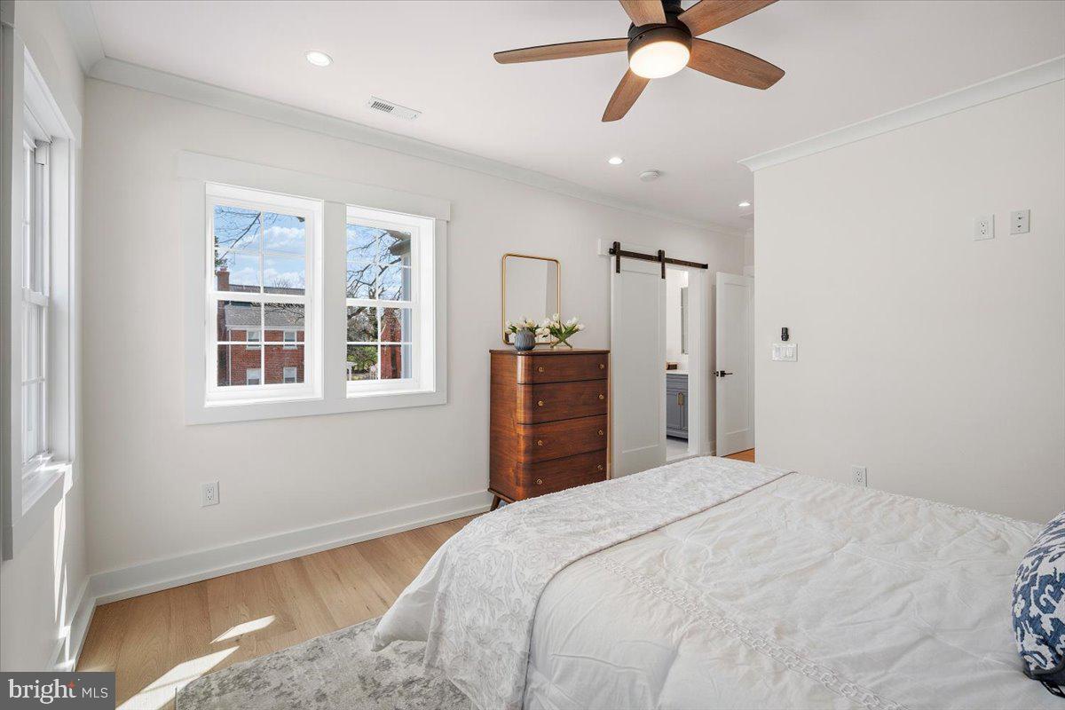 800 Elder Street Northwest Washington, DC 20012 - Photo 33 of 56 a bedroom with a bed dresser and a window