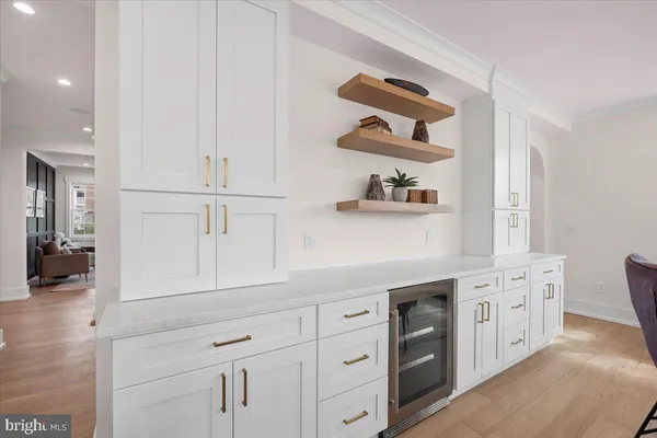 a living room with furniture a rug and a chandelier