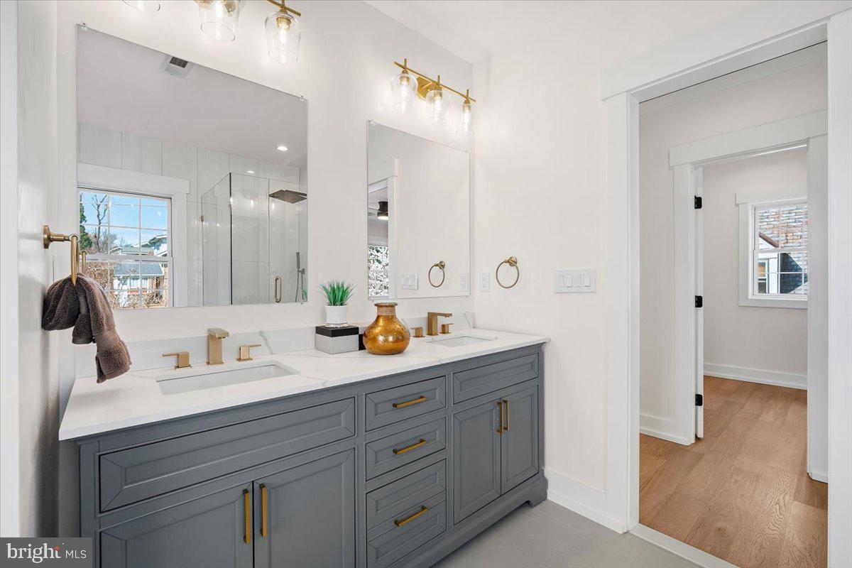 800 Elder Street Northwest Washington, DC 20012 - Photo 9 of 56 a bathroom with double sink and a mirror