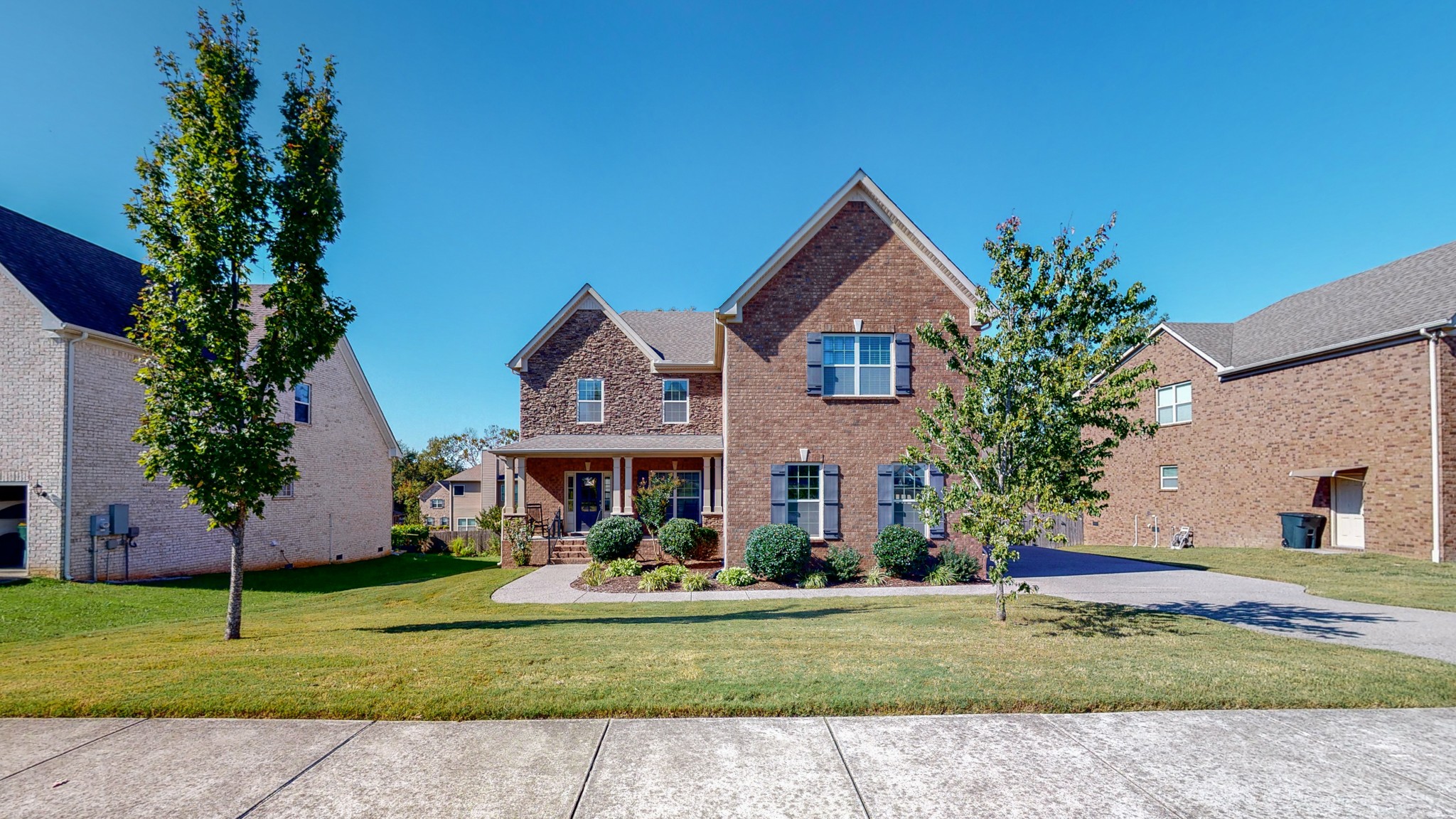 1004 Kyle Road Spring Hill, TN 37174 - Photo 1 of 40 a front view of a house with a yard and trees
