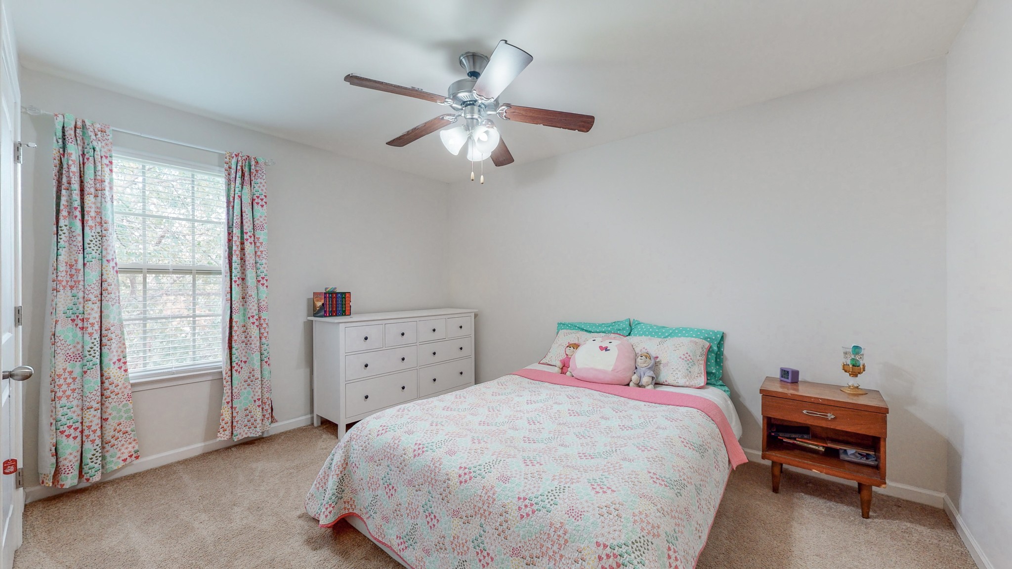 1004 Kyle Road Spring Hill, TN 37174 - Photo 23 of 40 a bedroom with a bed and a chandelier
