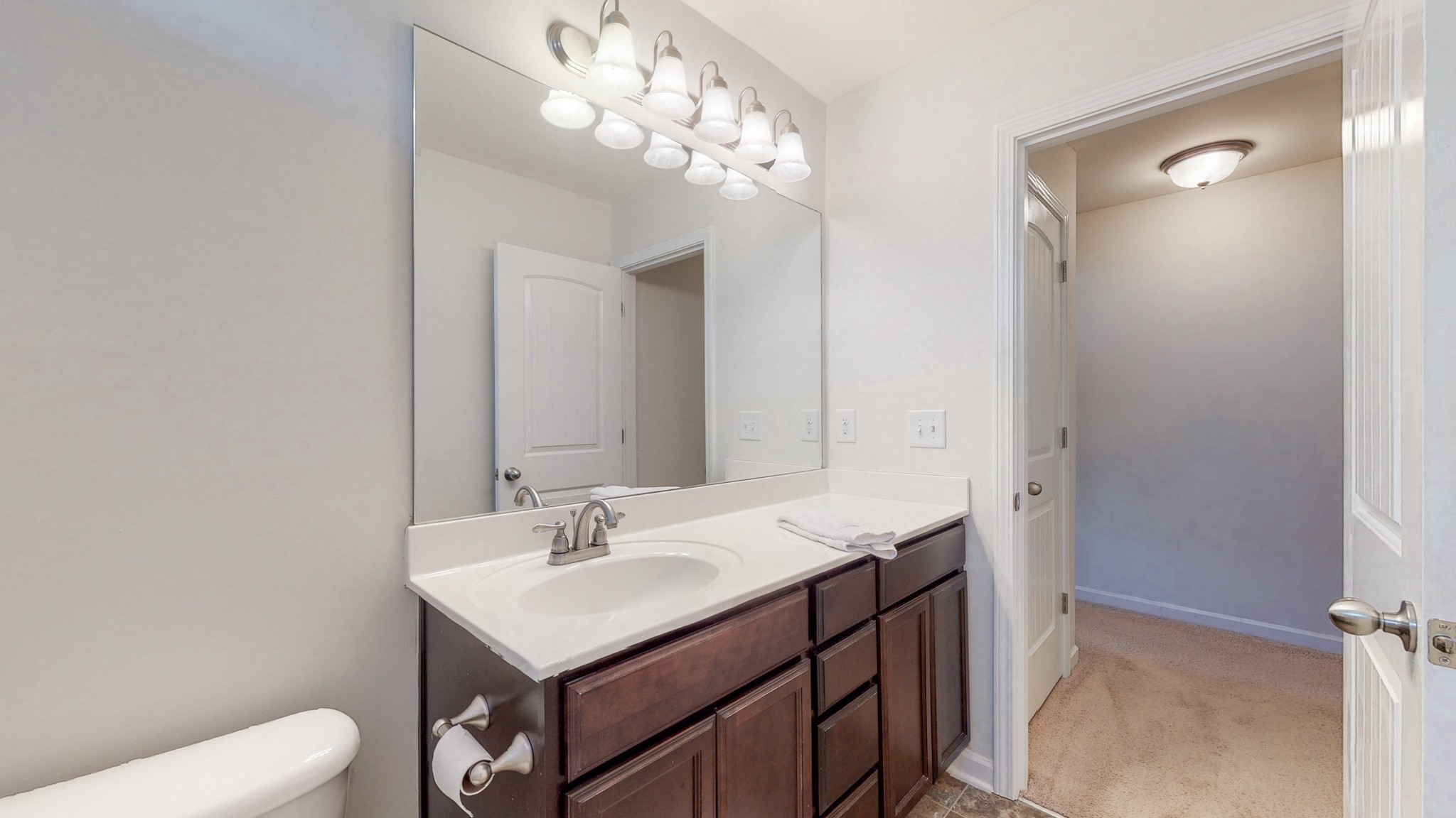 1004 Kyle Road Spring Hill, TN 37174 - Photo 29 of 40 a bathroom with a sink a toilet and a mirror