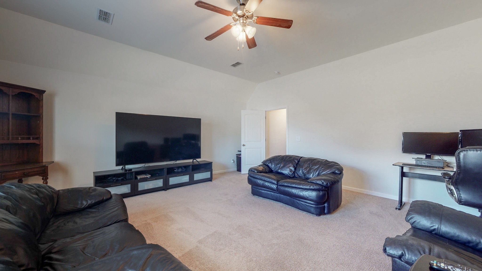 1004 Kyle Road Spring Hill, TN 37174 - Photo 31 of 40 a living room with furniture and a flat screen tv