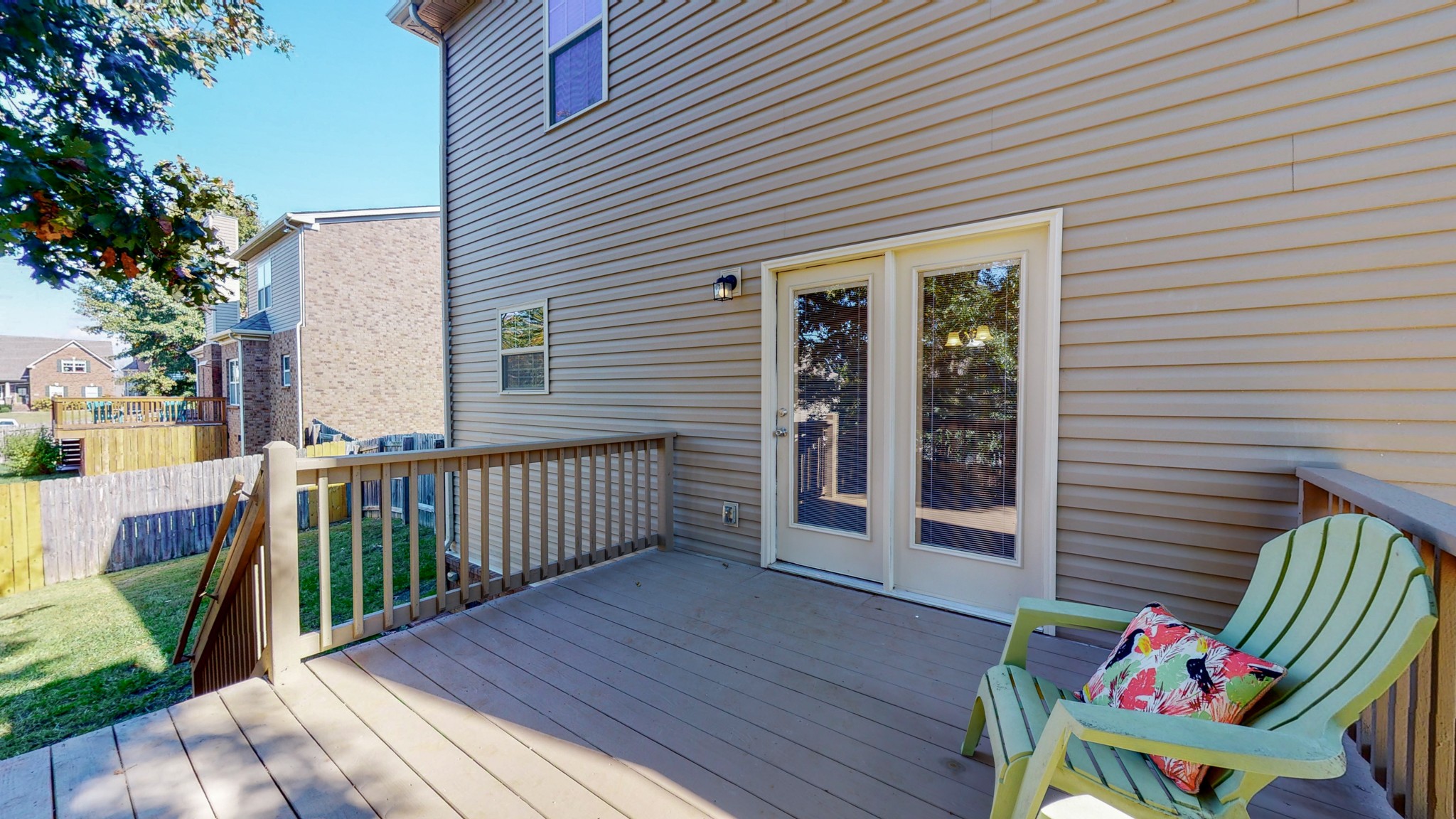 1004 Kyle Road Spring Hill, TN 37174 - Photo 34 of 40 a view of a deck with wooden floor and fence and a floor to ceiling window