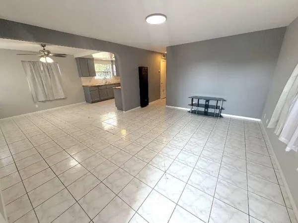 a view of an empty room and a window