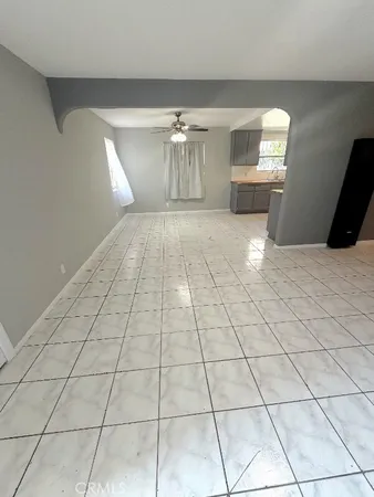 a view of empty room with windows