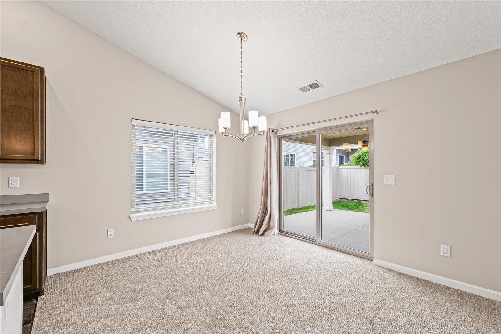 3109 Stanley Lane Champaign, IL 61822 - Photo 11 of 39 a view of a livingroom with a chandelier fan and windows