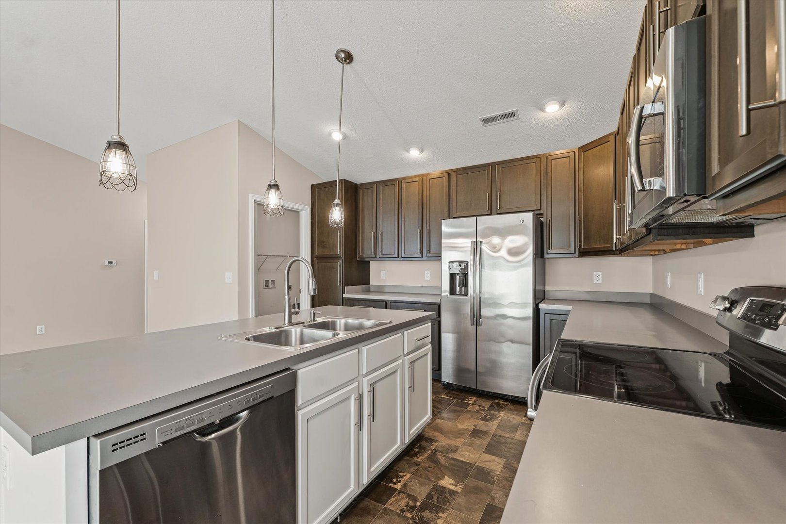 3109 Stanley Lane Champaign, IL 61822 - Photo 18 of 39 a kitchen with stainless steel appliances a sink stove and refrigerator