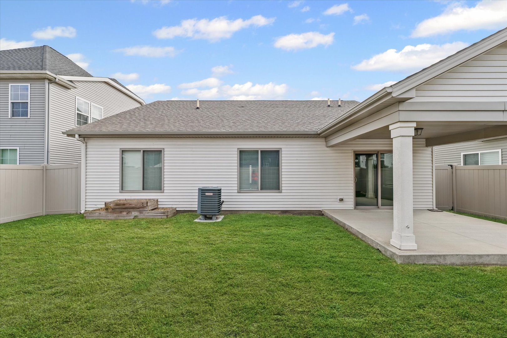 3109 Stanley Lane Champaign, IL 61822 - Photo 36 of 39 a view of a house with a yard and sitting area
