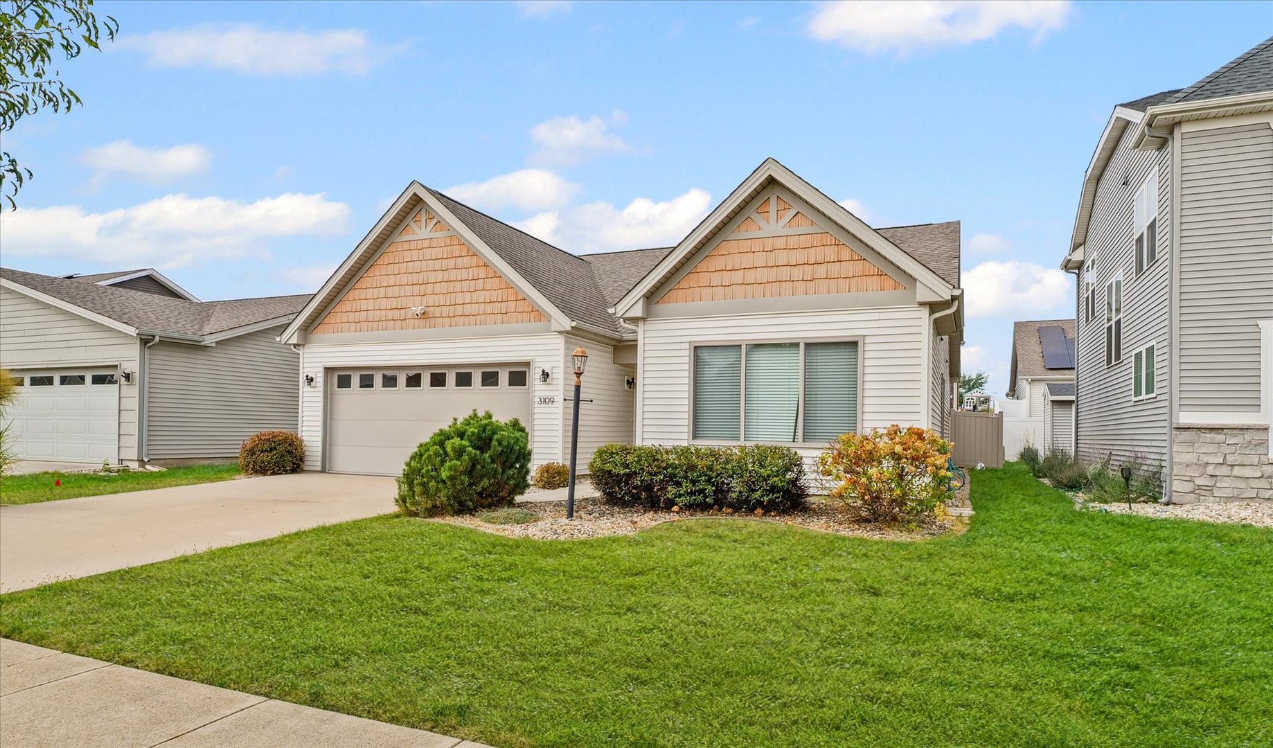 3109 Stanley Lane Champaign, IL 61822 - Photo 4 of 39 a view of a house with a yard and plants