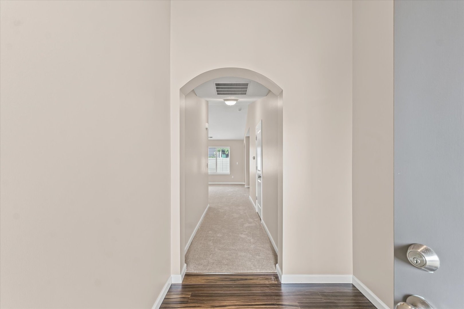 3109 Stanley Lane Champaign, IL 61822 - Photo 6 of 39 a view of a hallway with wooden floor and a bathroom