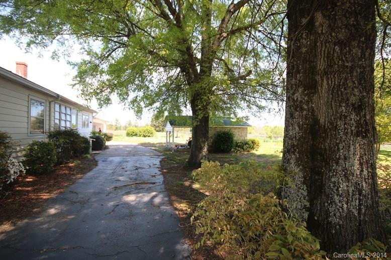 205 Currence Road, Unit 3 Clover, SC 29710 - Photo 14 of 19 a view of a yard with plants and trees