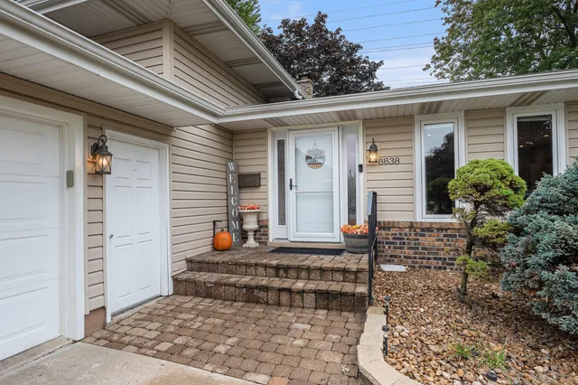 a view of a house with patio outdoor seating