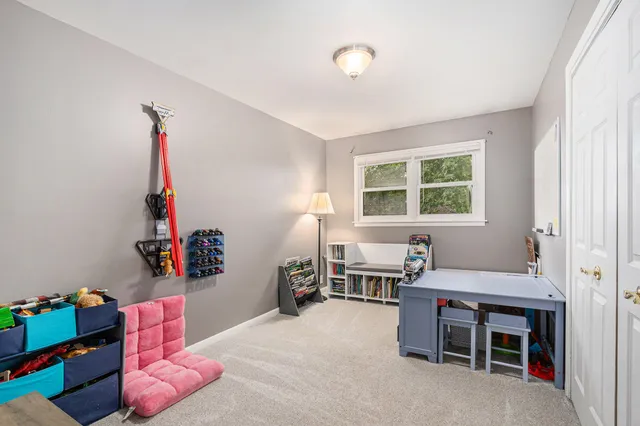 a bed room with furniture and a window