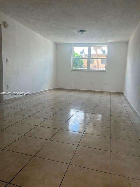 666 West 81st Street, Unit 103 Hialeah, FL 33014 - Photo 10 of 12 a view of an empty room with a window