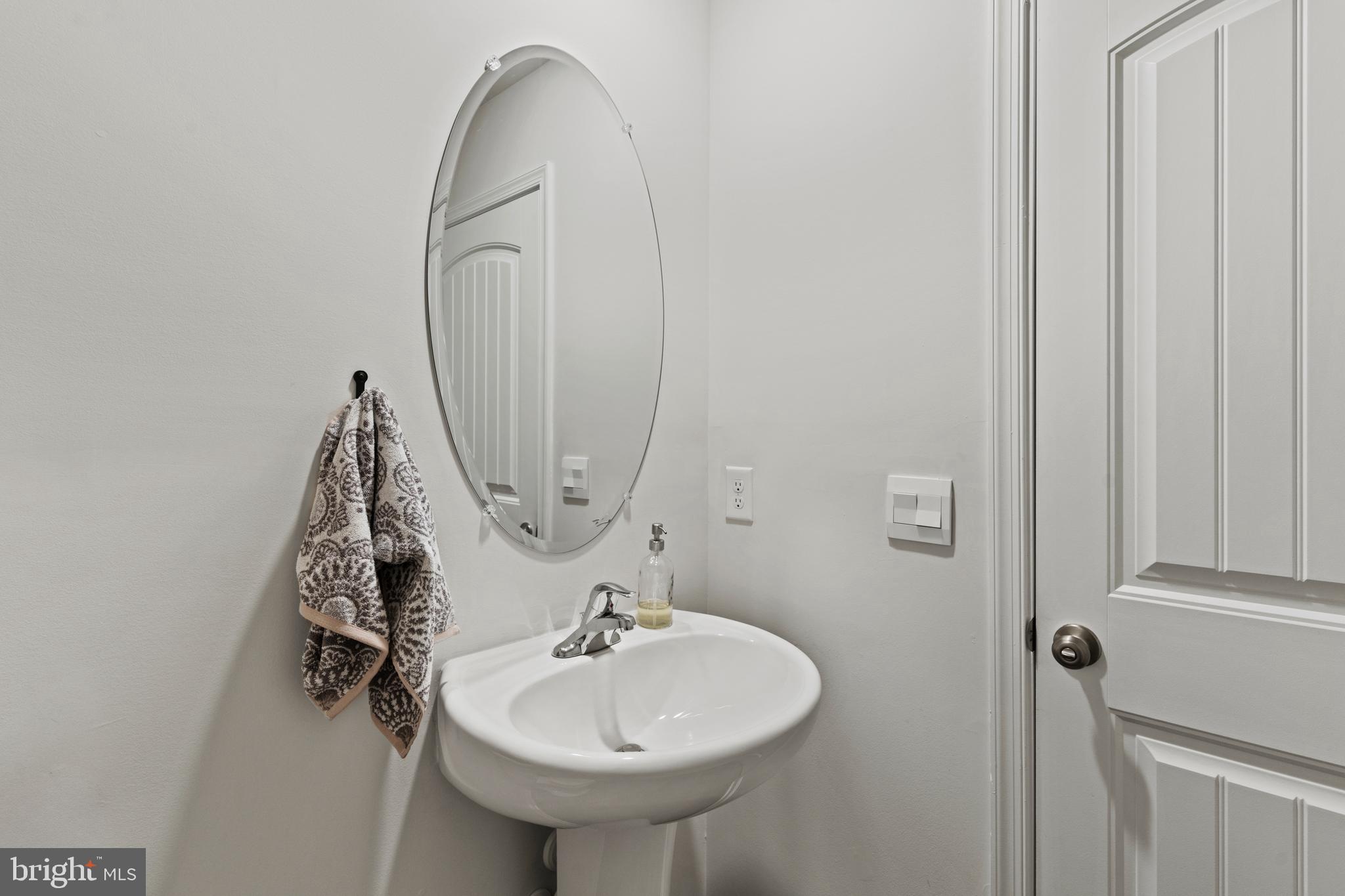 216 Silver Heel Road Chestertown, MD 21620 - Photo 17 of 32 a bathroom with a sink and mirror