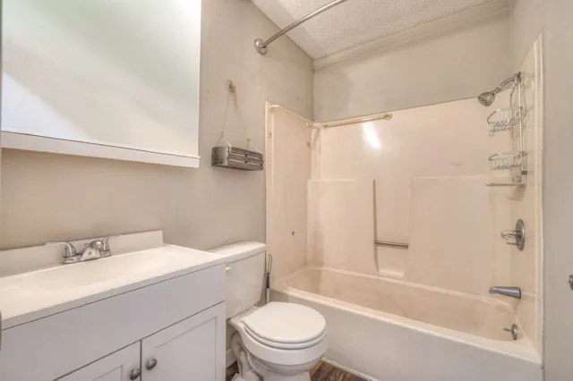 a bathroom with a sink a toilet and a bathtub