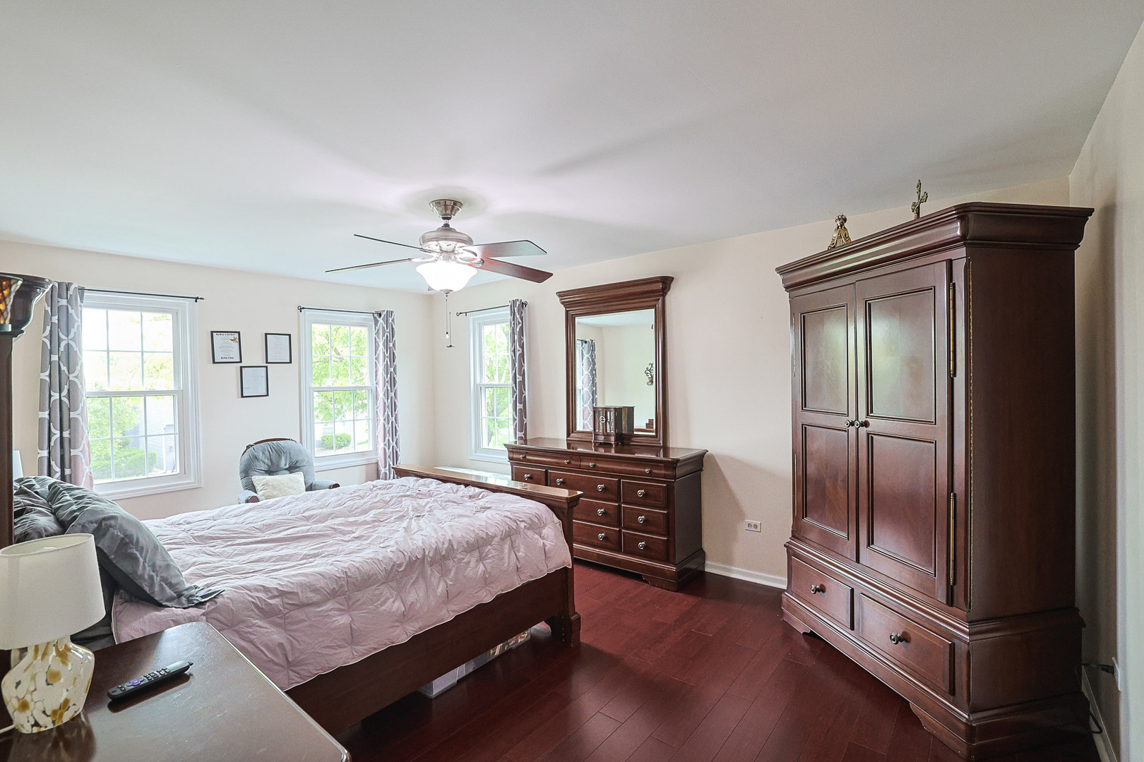 830 Hawk Lane Carol Stream, IL 60188 - Photo 13 of 30 a bedroom with a bed and a chandelier