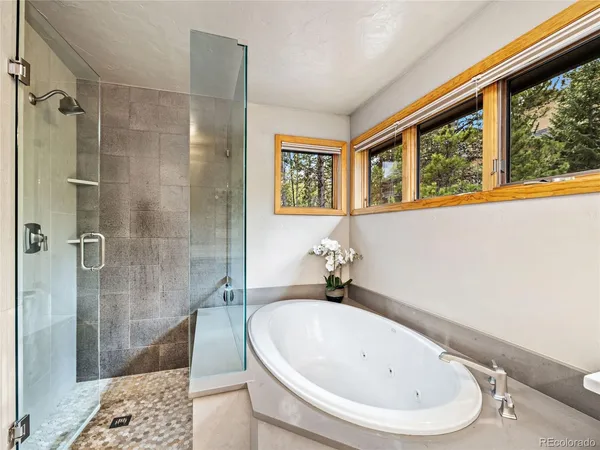 a bathroom with a sink and shower