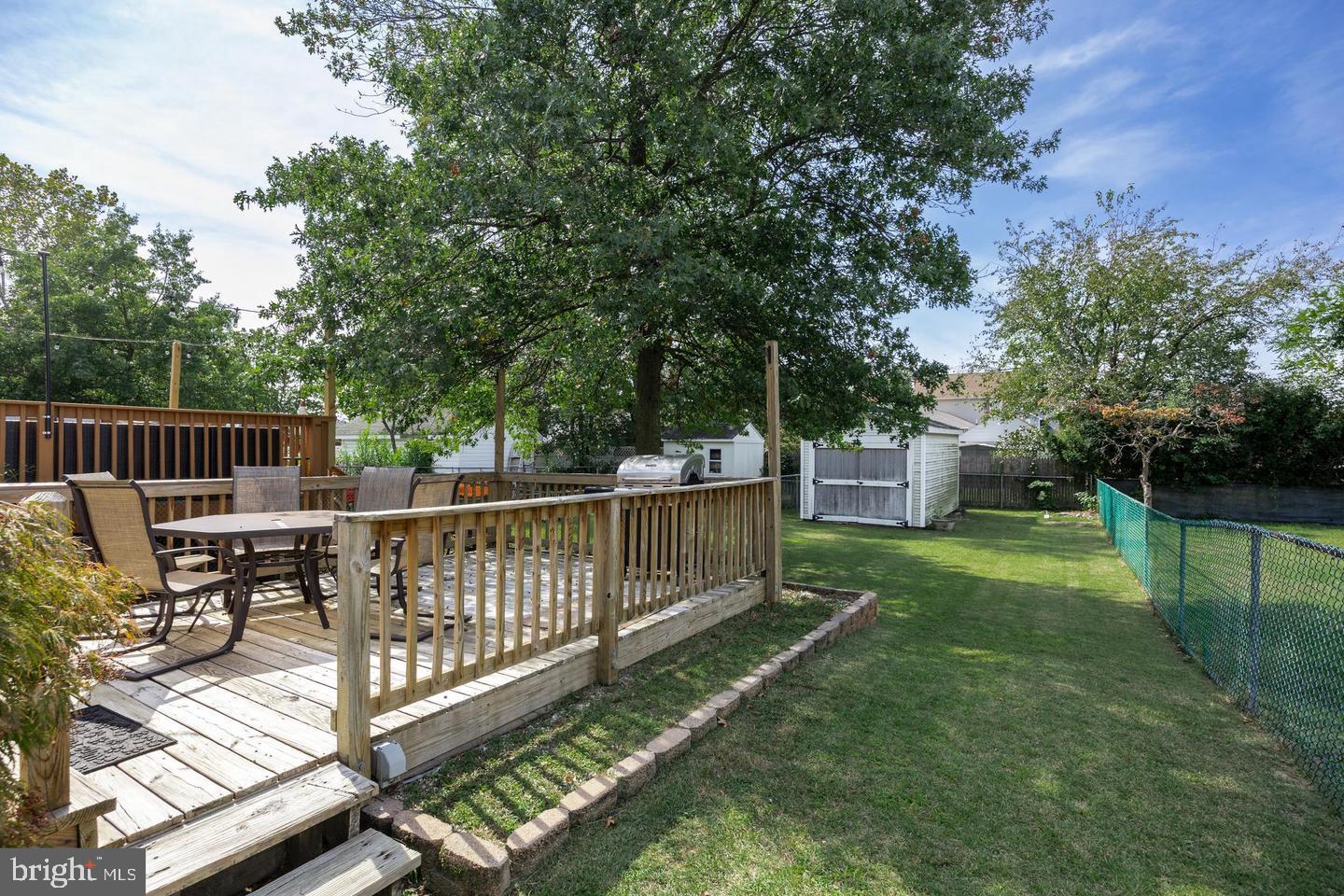 316 Lippincott Avenue Riverside, NJ 08075 - Photo 15 of 17 a view of a deck with two chair and a table