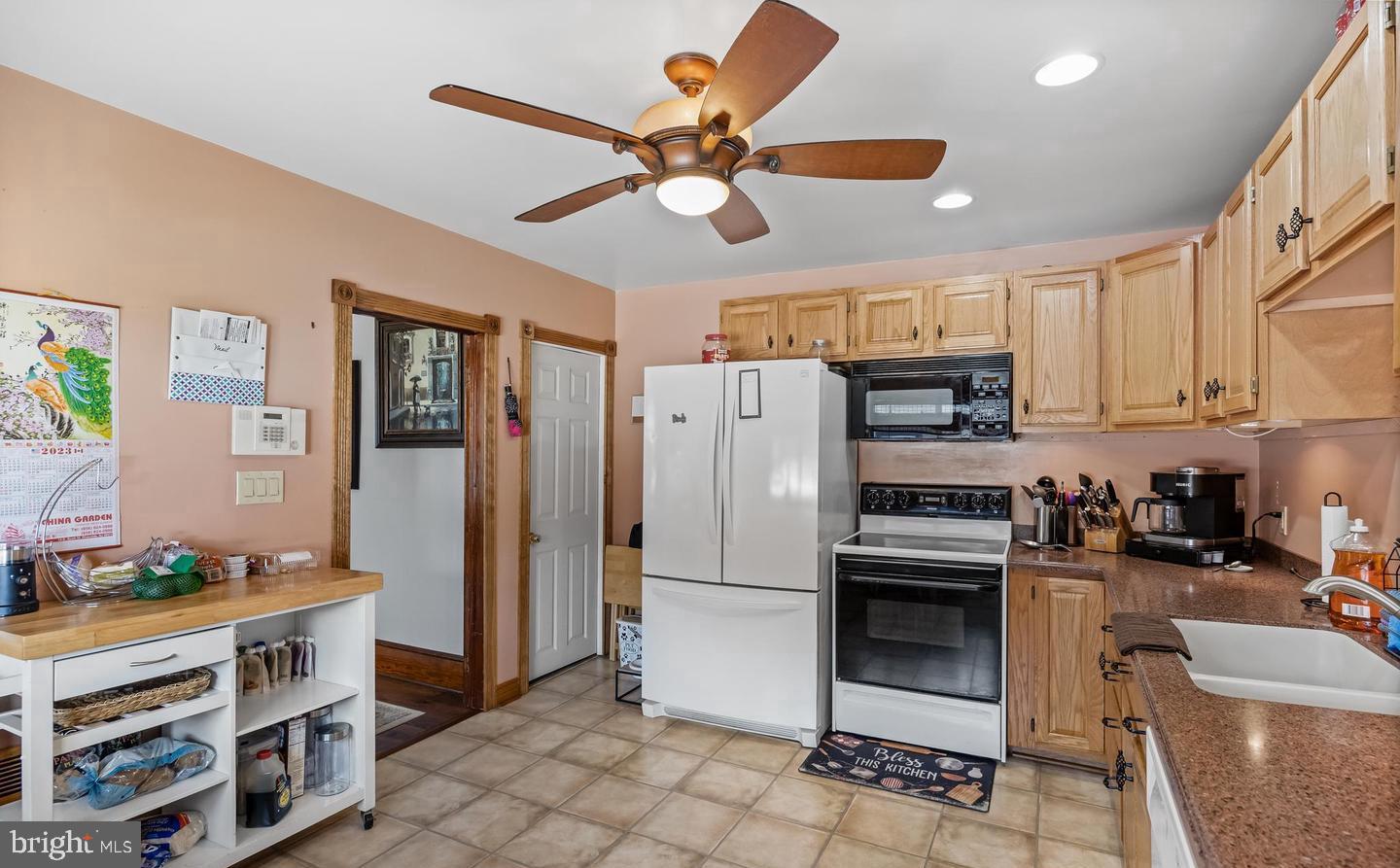 316 Lippincott Avenue Riverside, NJ 08075 - Photo 8 of 17 a kitchen with stainless steel appliances a stove a refrigerator cabinets and a dining table