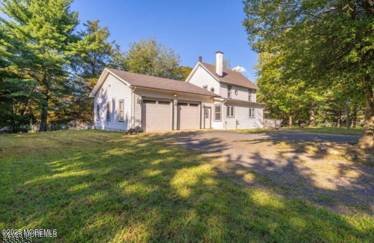 479 Line Road Matawan, NJ 07747 - Photo 1 of 17 a backyard of a house with table and chairs