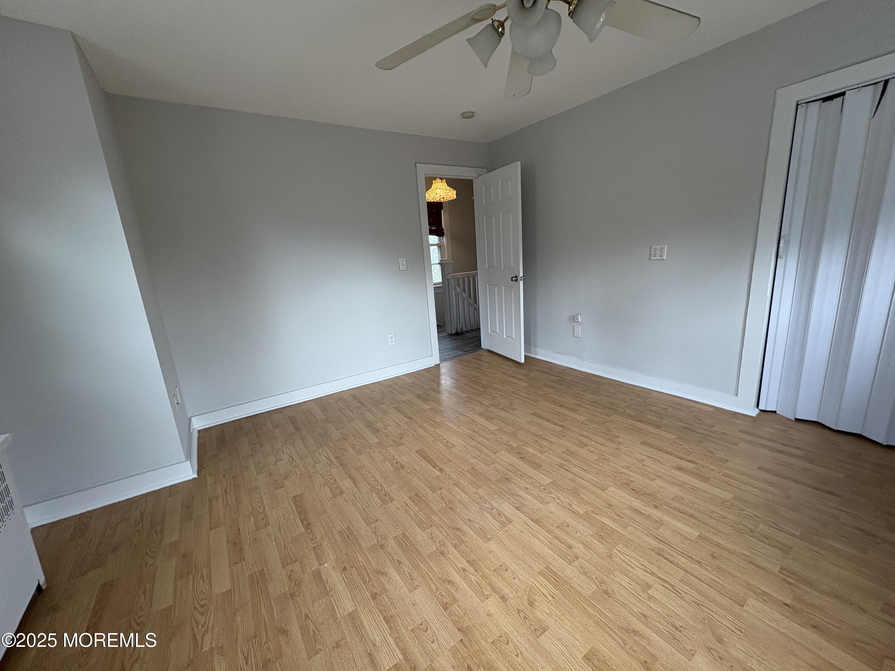 479 Line Road Matawan, NJ 07747 - Photo 13 of 17 wooden floor in an empty room with a window