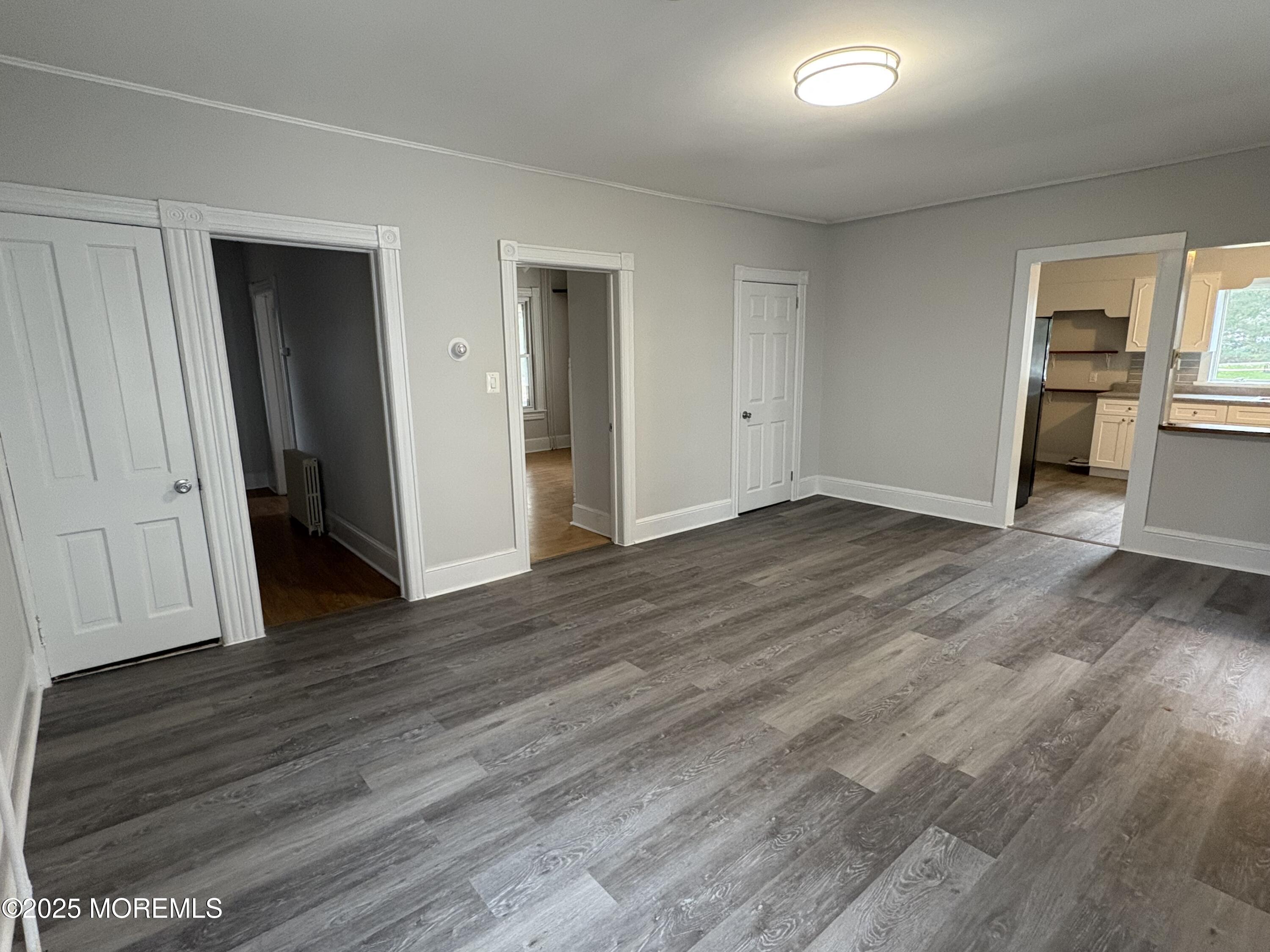 479 Line Road Matawan, NJ 07747 - Photo 6 of 17 an empty room with wooden floor and windows